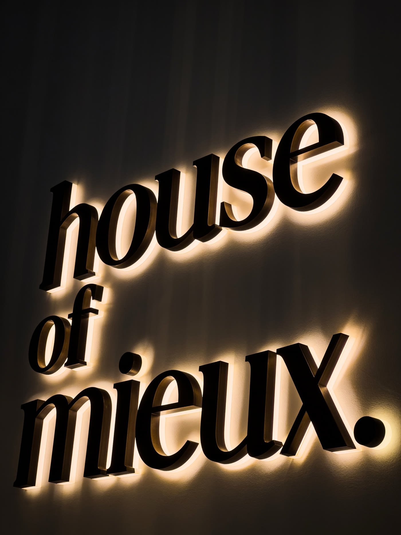 Backlit dimensional letters on an interior wall